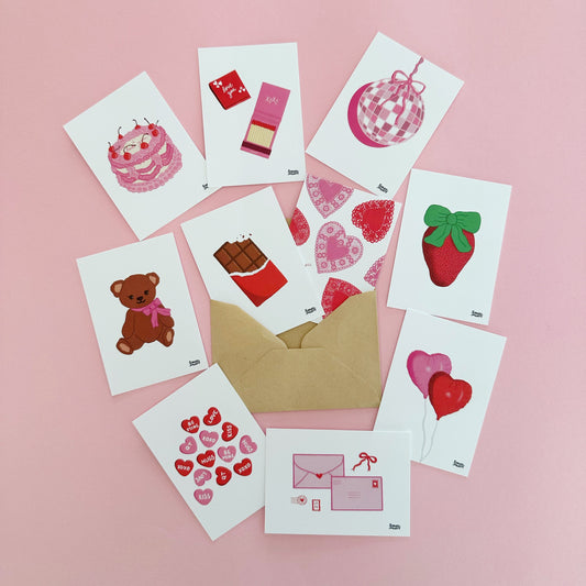 Set of small cards with various illustrations on a pink background